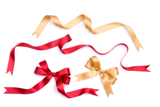 Ribbon and Bow Set A set of gold and red satin bows and ribbons.ALL NEW CHRISTMAS 2010 ribbon sewing item stock pictures, royalty-free photos & images