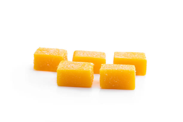 istock Mango jelly candies on white background 1828545485
