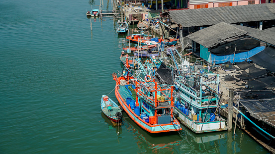 Thai fishing village. Scenic view of Fisherman Village in the Morning at Pak Nam Prasae Fisherman Village, Rayong Province, Thailand. An exotic tourist destination with an unusual infrastructure.