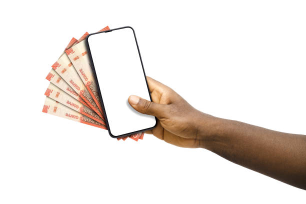istock Black hand holding mobile phone with blank screen and Chilean peso notes 1828552070