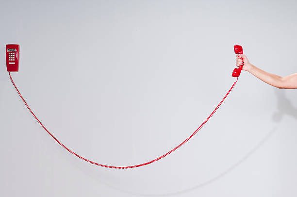 Female hand holding a red telephone.Take a look at my lightbox of other related images.