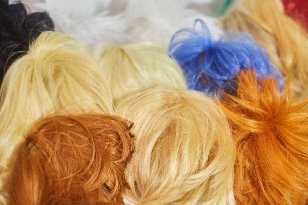 istock Hair texture from multi-colored wigs, synthetic and natural. 1828559954