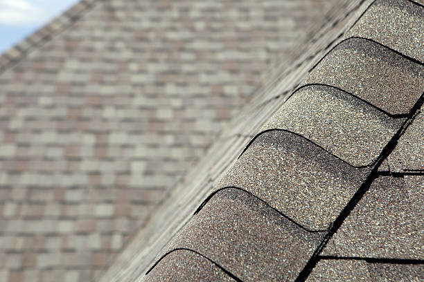 istock New Roof Cap Leads to Valley and Blurred Shingles 182856019