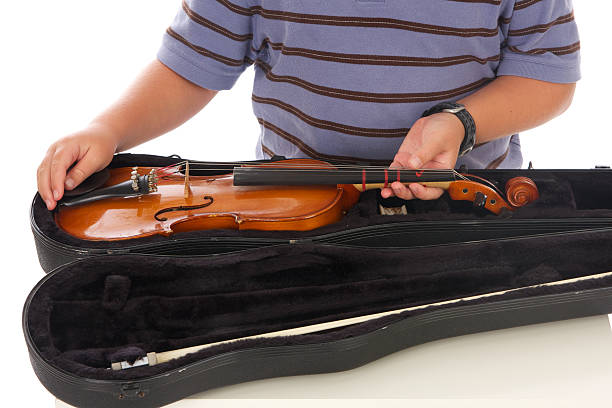 Boy Taking His Violin out of it' Case