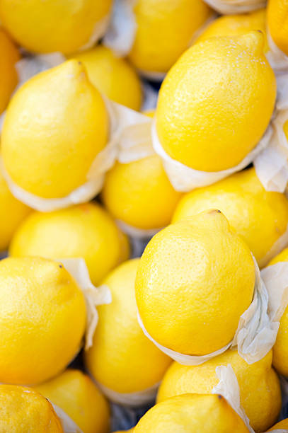 istock Full Frame Bright Yellow Lemons at Farmers Market 182856550