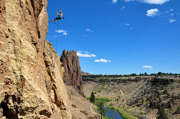 Rock Climber Rappelling stock photo