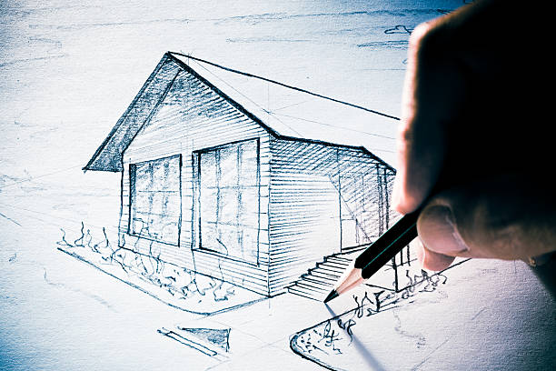 istock Hand sketching a little house 182857022