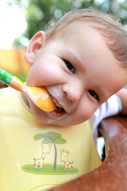 istock Toddler Eating Yogurt 182857053
