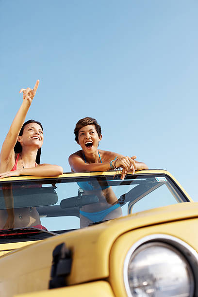istock Cheerful friends enjoying a drive 182857077