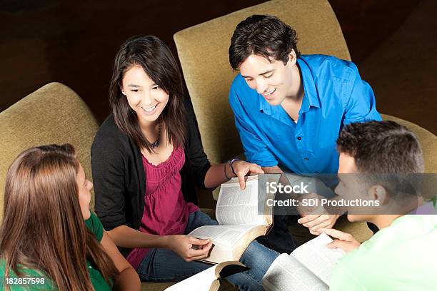 Group Of Friends Studying The Bible Together Stock Photo - Download Image Now - Bible, Small Group Of People, Studying