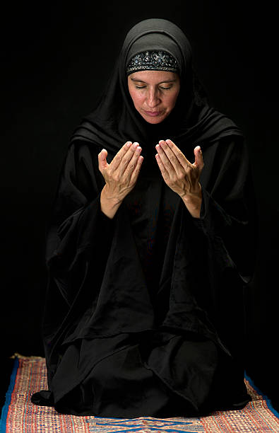 istock Muslim woman  praying 182857727