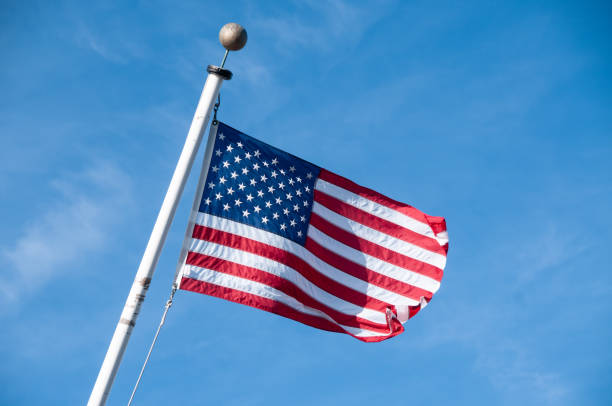 istock United States' flag fluttering in the wind 1828577317