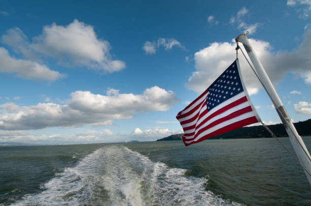 istock United States' flag fluttering in the wind 1828580080