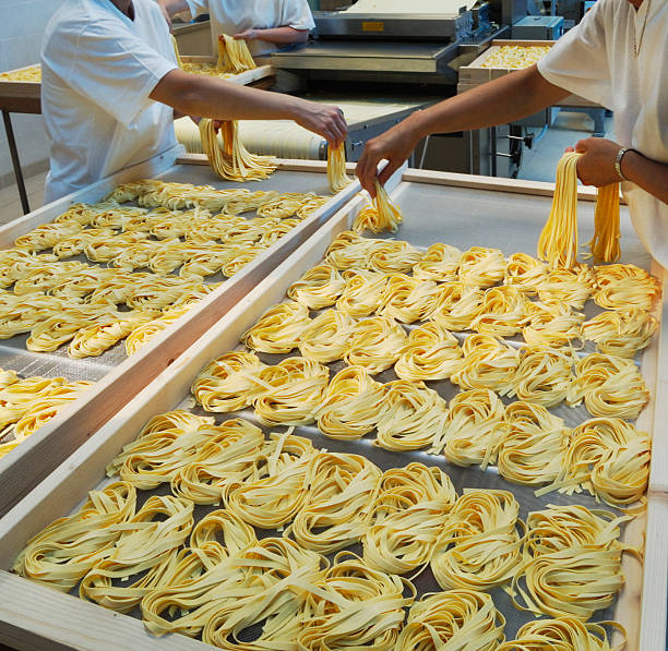 Hand made production of  tagliatelle (italian pasta) stock photo