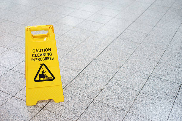 Cleaning in progress sign on the slippery floor