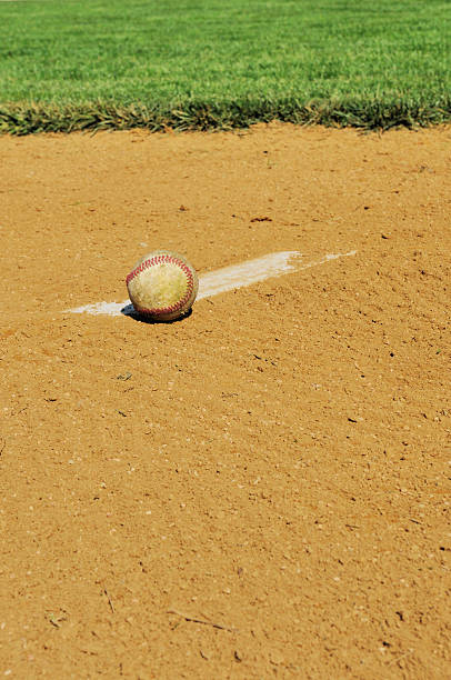 istock Pitcher's Mound Rubber, Dirt and Baseball in Field at Spring 182859172