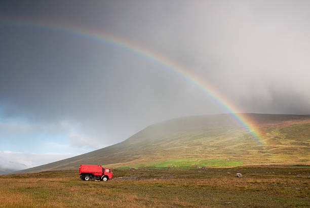 istock Old red truck under rainbow 182859317