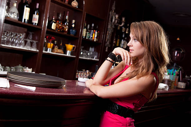 istock beautiful woman in the bar 182859424