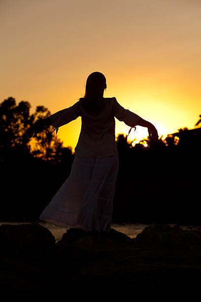 istock Young woman enjoying the sunset 182859670