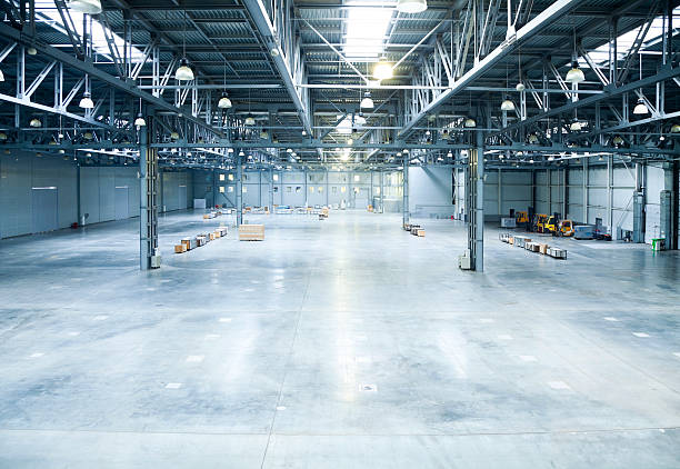 istock The inside of a large and empty modern warehouse 182859759