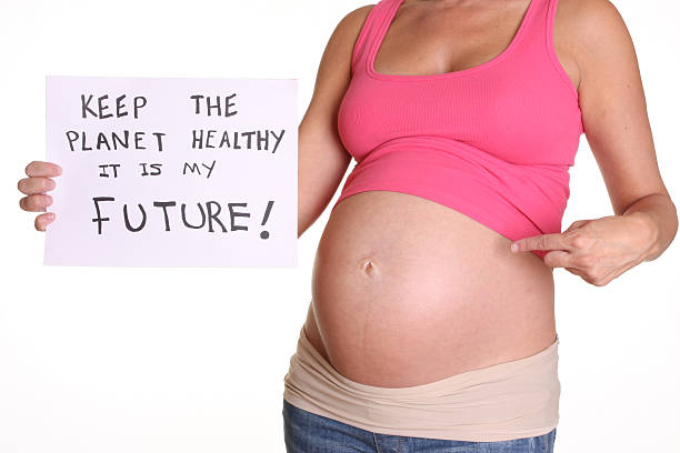 umwelt-konzept - human pregnancy earth globe mother stock-fotos und bilder