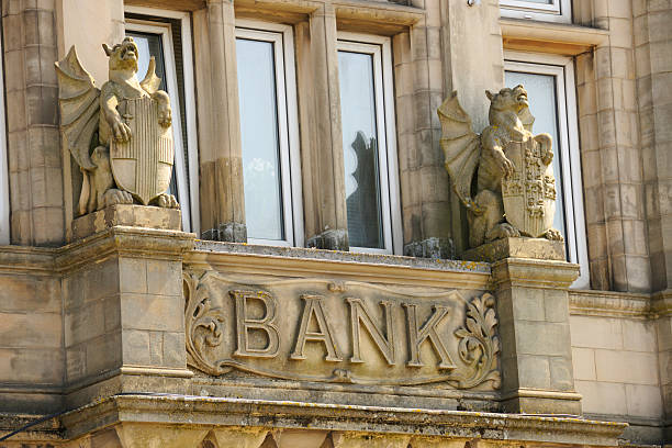istock Bank Sign on Old Building Protected by Stone Griffins 182860107