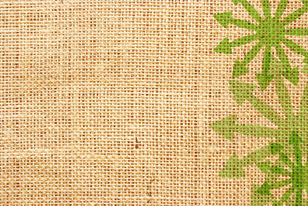 grüne pfeile auf hessian material - backgrounds burlap textured effect textile stock-grafiken, -clipart, -cartoons und -symbole