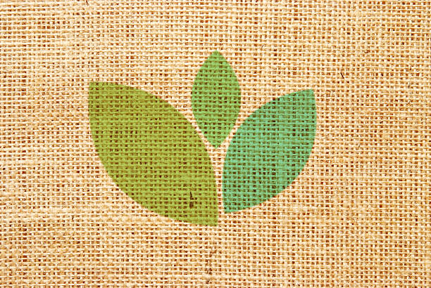 grüne blätter symbol - backgrounds burlap textured effect textile stock-grafiken, -clipart, -cartoons und -symbole