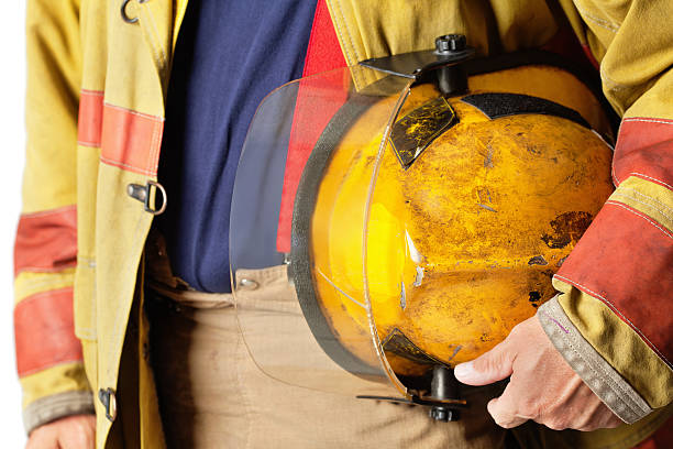 istock Closeup of Helmet Held By Firefighter 182860701