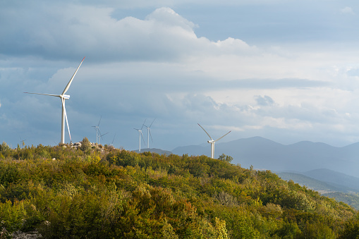 Wind turbines in the mountain woods in autumnal Croatia.