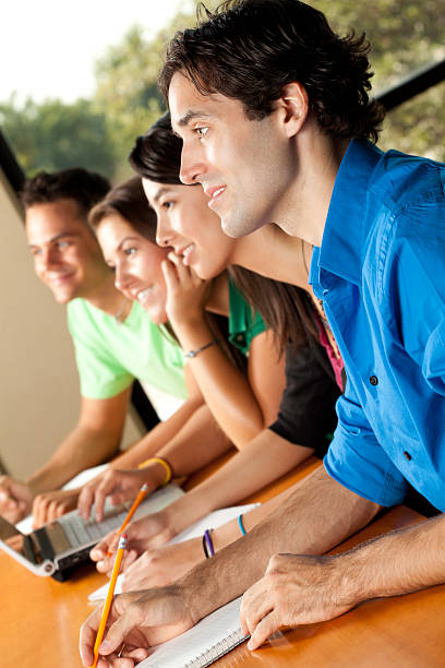 istock College Students Listening to Professor and Taking Notes 182861572