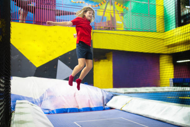 istock Child jumping in trampoline park. Bounce fun. 1828615793