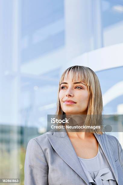 Businesswoman Smirking To The Side Stock Photo - Download Image Now - 30-39 Years, Adult, Adults Only