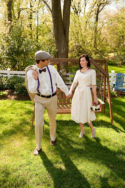 istock Handsome Groom walking with his Vintage Bride 182861890