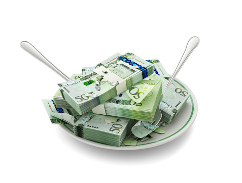 3D rendering of Libyan dinar notes on plate. Money spent on food concept. Food expenses, expensive meal, spending money concept. eating money, misuse of money
