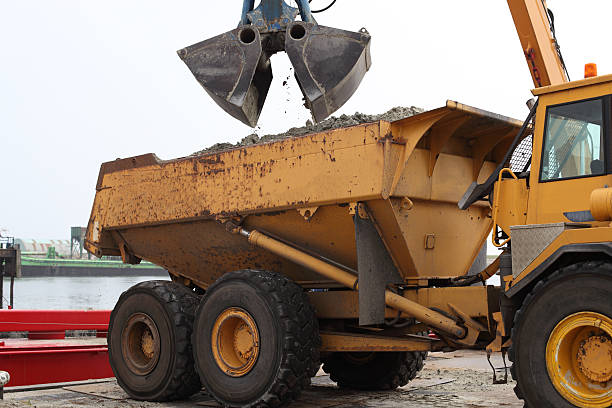 istock loading sand from boat to dumper truck 182862383