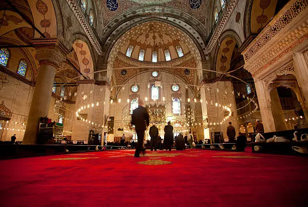 Muslim men praying inside the Blue Mosque Istanbul