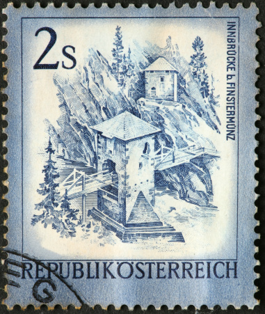 mountain bridge with towers on an Austrian stamp