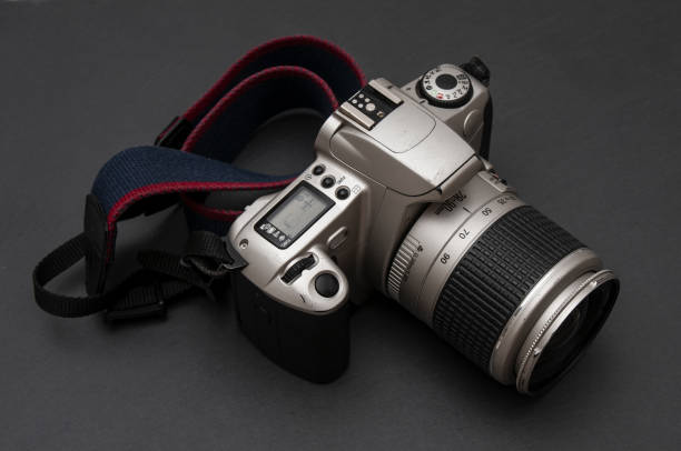 Old-fashioned film camera close up on a black background