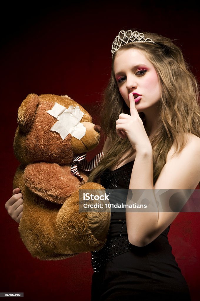 Beautiful princess with teddy bear Beautiful princess holding teddy bear and gesturing for being quiet.. Adult Stock Photo