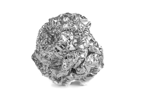 istock Crumpled aluminium foil close up on a white background 1828638802