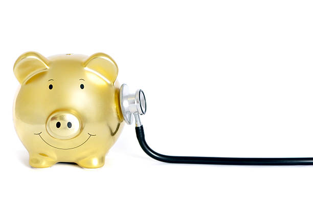 banco piggy dr. - currency stethoscope healthcare and medicine savings - fotografias e filmes do acervo