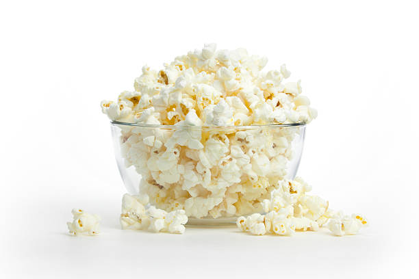 Hot, Fresh Popcorn A glass bowl overflowing with mouth-watering popcorn.Click on the banner below to see more photos like this. Popcorn stock pictures, royalty-free photos & images