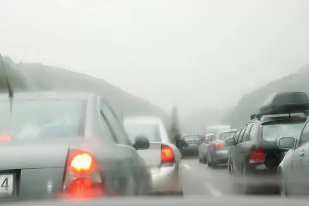 "Traffic jam in rainy day shot through windshield. San Gottardo, Switzerland.Please check my photos : Driving through snow storm:"