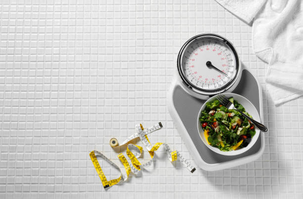 istock Salad on Bathroom Scales 182864274