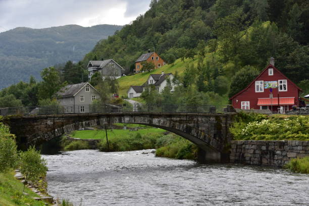 istock A stone bridge and a red house along a river, in Norway 1828644208