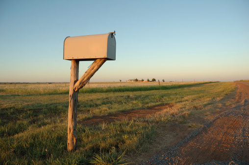 Lone mailbox at sunset in the country.