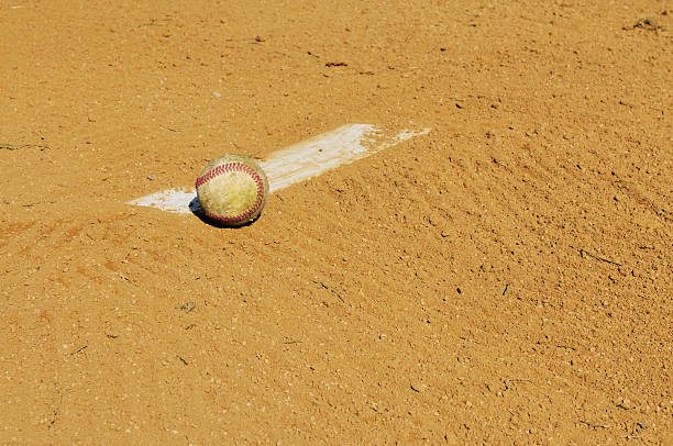 istock Pitcher's Mound Rubber, Dirt and Baseball in Field at Spring 182864923