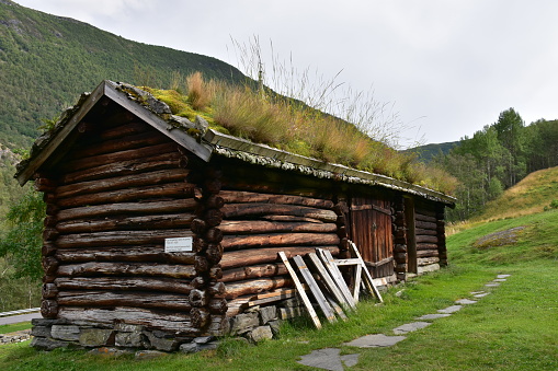 Traditional house among the meadows of the high Gressoney Valley, one of the several valleys belonging to the Aosta Valley, a mountainous semi-autonomous region in northwestern Italy. The valley was inhabited at the end of the Middle Ages by Walser, native peoples in the Upper Valais, which have left traditions and a popular architecture still visible today. Valle d'Aosta, Italy