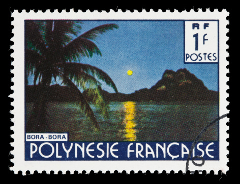 A French Polynesia postage stamp depicting the moon over Bora Bora.